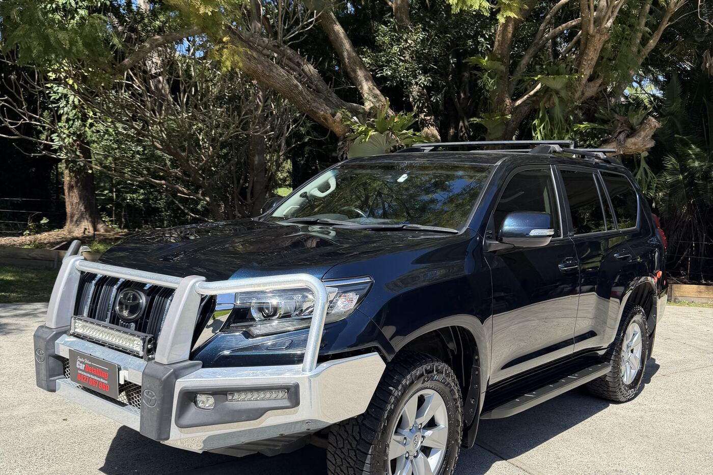 A dark Toyota Prado detailed by Jayden Nelson, paint reflecting cleanly